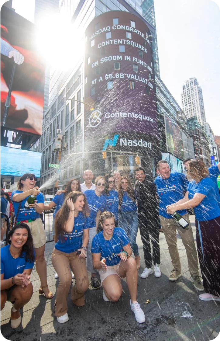 Our team poping champagne to celebrate our Series F funding on Times square